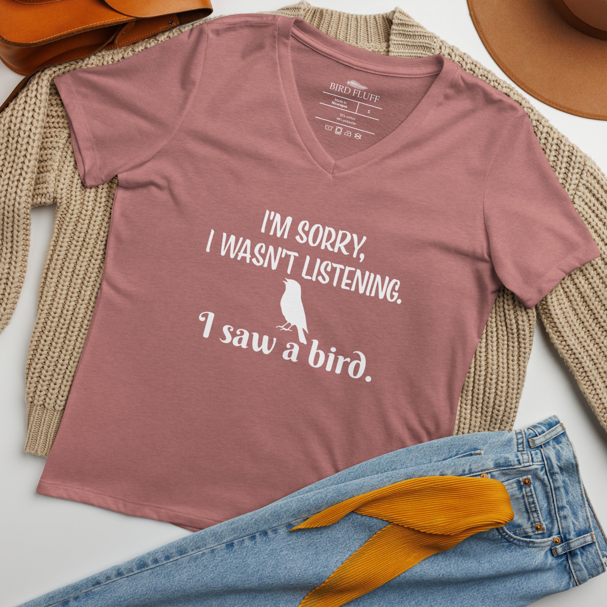 Heather mauve women's relaxed v-neck bird t-shirt with the words I'm sorry I wasn't listening, I saw a bird. And a graphic of a songbird. Outfit idea.
