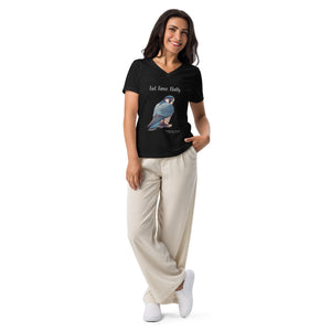 Black women's v-neck bird t-shirt with the words, Fast. Fierce. Fluffy. and a peregrine falcon graphic below. Worn by a woman on a white background.